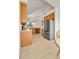 Bright kitchen featuring stainless steel refrigerator and tile flooring at 5341 N Rhyolite Way, Parker, CO 80134