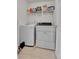 Laundry room featuring washer, dryer, shelf and tile flooring at 5341 N Rhyolite Way, Parker, CO 80134
