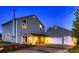 Charming two-story home featuring an attached garage and covered entryway, perfect for suburban living at 8370 Midsummer Ln, Elizabeth, CO 80107