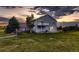 Two-story home with a small balcony, well-maintained lawn, and a charming country setting at 8370 Midsummer Ln, Elizabeth, CO 80107