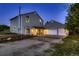 Beautiful two-story house with an attached two-car garage and cozy front porch seating area, set for comfort at 8370 Midsummer Ln, Elizabeth, CO 80107