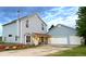 Attractive two-story home boasts a spacious garage and covered porch, ideal for outdoor relaxation at 8370 Midsummer Ln, Elizabeth, CO 80107