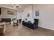 Comfortable living room features tiled floors, a rocking chair, and a plush couch, ideal for Gathering time at 8370 Midsummer Ln, Elizabeth, CO 80107