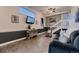 Cozy living room features tiled floors, a rustic cabinet, and a comfortable couch, perfect for relaxation at 8370 Midsummer Ln, Elizabeth, CO 80107