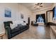 Inviting living room with tiled floors, comfortable seating, and stylish decor, perfect for relaxing evenings at 8370 Midsummer Ln, Elizabeth, CO 80107