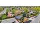 Aerial view of a home with mature trees, fenced backyard, and neighboring houses at 2320 S Valley Hwy, Denver, CO 80222