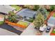 Aerial view of a single-story home with a dark gray roof, RV parking, and fenced backyard at 2320 S Valley Hwy, Denver, CO 80222