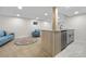 Basement with a wet bar, mini fridge, and comfortable seating area at 2320 S Valley Hwy, Denver, CO 80222