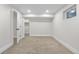 Clean basement bedroom with neutral carpeting and a small window at 2320 S Valley Hwy, Denver, CO 80222