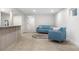 Basement area featuring plush sofas, a wet bar, and neutral carpeting at 2320 S Valley Hwy, Denver, CO 80222