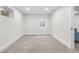 Spacious basement room featuring neutral carpeting and a window at 2320 S Valley Hwy, Denver, CO 80222