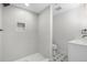 Clean bathroom featuring modern fixtures, a shower, and patterned tile floor at 2320 S Valley Hwy, Denver, CO 80222