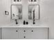 Bathroom features double vanity with modern fixtures, and tiled shower at 2320 S Valley Hwy, Denver, CO 80222