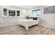 Sunlit bedroom boasts a plush bed, bay window, and convenient closet space at 2320 S Valley Hwy, Denver, CO 80222