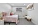 Comfortable bedroom featuring a daybed with plush pillows and a cozy bench at 2320 S Valley Hwy, Denver, CO 80222