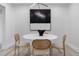 Bright dining room featuring a round white table, modern art, and seating for four with stylish decor at 2320 S Valley Hwy, Denver, CO 80222