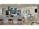 Modern kitchen with spacious island open to dining area and stainless steel appliances at 2320 S Valley Hwy, Denver, CO 80222