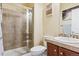 Bathroom with walk in shower, vanity with sink and decorative mirror at 42350 Forest Oaks Dr, Elizabeth, CO 80107