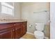 Half-bathroom includes a toilet, sink, and vanity providing convenience and functionality at 42350 Forest Oaks Dr, Elizabeth, CO 80107