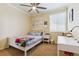 Cozy bedroom featuring a ceiling fan, soft lighting, and a comfortable bed at 42350 Forest Oaks Dr, Elizabeth, CO 80107