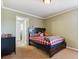 Inviting bedroom with a comfortable bed, and connecting door to the bathroom at 42350 Forest Oaks Dr, Elizabeth, CO 80107