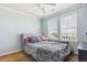 Well-lit bedroom with soft, neutral walls, a plush headboard, and a ceiling fan at 42350 Forest Oaks Dr, Elizabeth, CO 80107