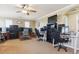 Spacious bonus room with multiple workstations, offering versatility for work and recreation at 42350 Forest Oaks Dr, Elizabeth, CO 80107