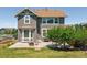 Exterior rear of the home with a patio and chairs with a fire pit at 42350 Forest Oaks Dr, Elizabeth, CO 80107
