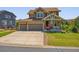 Charming two-story home with a three-car garage and well-maintained front lawn at 42350 Forest Oaks Dr, Elizabeth, CO 80107