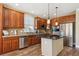 Modern kitchen with stainless steel appliances, hardwood floors, and granite countertops at 42350 Forest Oaks Dr, Elizabeth, CO 80107