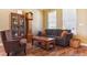 Cozy living room with comfortable seating, hardwood floors and decorative cabinet at 42350 Forest Oaks Dr, Elizabeth, CO 80107