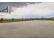 Community basketball court with hoops and ample space for recreational sports and outdoor activities in a residential area at 676 Hedgerow Way, Brighton, CO 80601