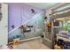 Playful bedroom featuring a bunk bed, shelving and a colorful decor at 676 Hedgerow Way, Brighton, CO 80601