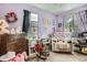 Comfortable bedroom showcasing a recliner, desk, and other decorative elements at 676 Hedgerow Way, Brighton, CO 80601