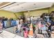 Spacious garage with ample storage space and various tools and equipment at 676 Hedgerow Way, Brighton, CO 80601