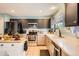 Modern kitchen featuring white cabinets, stainless steel appliances, and ample counter space at 676 Hedgerow Way, Brighton, CO 80601