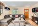 Inviting living room features a large sectional sofa and stylish decor at 676 Hedgerow Way, Brighton, CO 80601