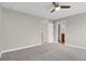 Spacious carpeted bedroom with neutral paint and ceiling fan at 26167 E Byers Pl, Aurora, CO 80018