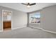 Bedroom featuring a window with neighborhood views and an ensuite bathroom with granite counters at 26167 E Byers Pl, Aurora, CO 80018