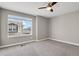 Carpeted bedroom featuring a bright window and neutral paint color at 26167 E Byers Pl, Aurora, CO 80018