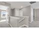Upstairs hallway featuring neutral carpeting and painted walls at 26167 E Byers Pl, Aurora, CO 80018