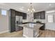 A modern kitchen featuring granite countertops, ample storage, and stainless steel appliances at 26167 E Byers Pl, Aurora, CO 80018