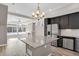 A well-equipped kitchen with an island, stainless appliances, and abundant natural light at 26167 E Byers Pl, Aurora, CO 80018