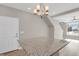Bright kitchen features granite counters, modern light fixture and opens to the staircase and entryway at 26167 E Byers Pl, Aurora, CO 80018