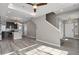 Spacious living room with a view of kitchen, featuring hardwood floors, recessed lighting, and a ceiling fan at 26167 E Byers Pl, Aurora, CO 80018