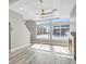 A bright living room filled with natural light and featuring large windows at 26167 E Byers Pl, Aurora, CO 80018