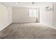 Unfinished basement with neutral carpet and window at 9741 Moss Rose Cir, Highlands Ranch, CO 80129