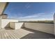 Outdoor rooftop deck offering city skyline views on a sunny day at 2443 W 69Th Pl, Denver, CO 80221