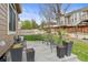 Charming backyard with a stone patio, lush lawn, privacy fence, and well-maintained landscaping at 17297 Opal Hill Dr, Parker, CO 80134
