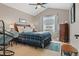 Cozy bedroom with neutral walls, plush carpet, and a window with natural light at 17297 Opal Hill Dr, Parker, CO 80134